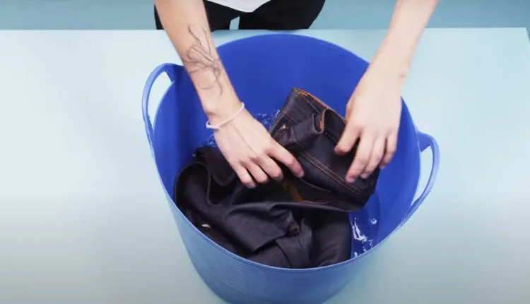 Wash or Boil the Jeans to reduce gap in back